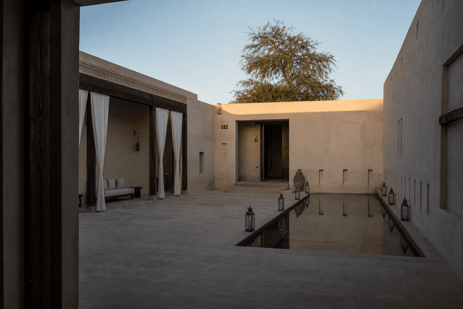 The lime-plaster courtyard and reflecting pool at dawn